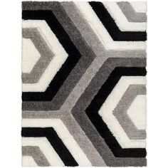 an area rug with black, grey and white colors