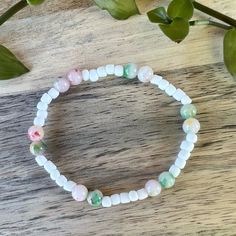 Brighten Up Your Day With Our Handmade White Beaded Bracelet! This Charming Accessory Is Crafted With High-Quality Beads And A Durable Elastic String, Making It Comfortable To Wear And Perfect For Any Occasion. Featuring A Lovely Mix Of Soft Pastel Shades, This Bracelet Is The Perfect Way To Add Personality To Your Outfit. Wear It To The Office, Out With Friends, Or Even Just Around The House - This Bracelet Is Versatile And Fun! Our Handmade Bracelet Is A Thoughtful And Genuine Gift For Anyone Bohemian Stretch Bracelet With Round Beads For Spring, Casual Beaded Bracelets With Round Beads For Spring, Casual Stretch Bracelet With Round Beads For Spring, Bohemian Stretch Bracelet With Colorful Beads For Spring, Casual Tiny Beads Bracelets For Spring, Casual Tiny Beads Bracelet For Spring, Casual Tiny Beaded Bracelets For Spring, Bohemian Beaded Bracelets With Tiny Beads For Spring, Spring Bohemian Beaded Bracelets With Tiny Beads