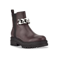 a pair of brown boots with chains on the side and black outstep,