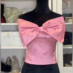 New, Never Worn, Without Tags. Fall In Love With Soft Pink Bow Top! This Tube Top Features A Soft And Stretchy Shimmery Material, A Stretchy Smocked Back, A Front Statement Bow Detail, And A Cropped Sleeveless Tube Top Fit. This Statement Piece Adds The Sweetest Touch To Any Look! Pair With Your Favorite Denim Or Trouser For The Perfect Valentine's Day Fit. Wear The Bow 2 Different Ways. 60% Polyester 35% Nylon 5% Spandex Length 13inches Ships Next Business Day Chic Pink Party Top, Pink Fitted Strapless Top, Summer Evening Top With Bow Detail, Summer Evening Top With Bow, Feminine Party Tops With Bow Detail, Fitted Strapless Pink Top, Feminine Evening Tops With Bow Detail, Feminine Evening Tops With Bow, Pink Fitted Flirty Top