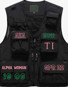 a black vest with pink and green letters on the front, two zippers at the back