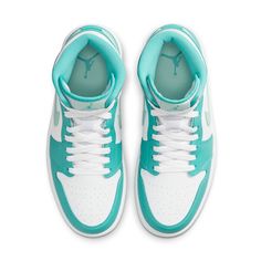 Introducing the new Women's Air Jordan 1 Mid Marine Green sneakers. A bold offering from Jordan brand, these shoes proudly symbolize the legacy of Michael Jordan and his original Air Jordan 1s from 1985. Crafted with high-top construction and white laces, these sneakers feature island green highlights that subtly stand out against the predominantly white upper. Core details like the Nike Swoosh on the side, the Air Jordan logo on the outer ankle, and Jumpman logo on the tongue complete for a modern look that is steeped in tradition. The sleek design of the Women's Air Jordan 1 Mid Marine Green successfully combines style with substance for a sneaker worthy of any look. Teal Jordans, Jordan 4 Nike, Air Jordan 1 Mid Women, Nike Jordan 4, Cute Jordans, Nike Jordan 1 Mid, Bday Stuff, Original Air Jordans, Wmns Air Jordan 1