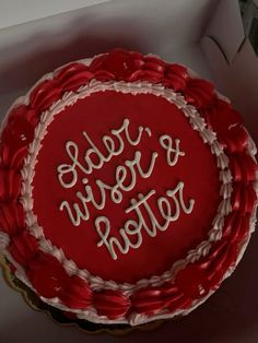 a red and white cake with writing on it