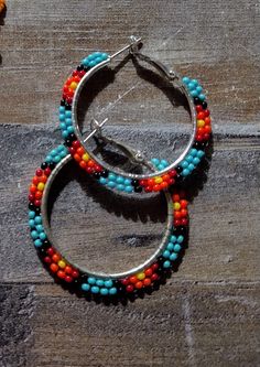 Colorful tribal hoop earrings on metal lever back hoops Multicolor Bohemian Hoop Jewelry, Bohemian Multicolor Hoop Jewelry, Adjustable Multicolor Nickel-free Jewelry, Multicolor Hoop Earrings With Ear Wire, Bohemian Multicolor Hoop Earrings, Colorful Bohemian Hoop Jewelry, Colorful Beaded Round Hoop Earrings, Multicolor Circular Hoop Earrings For Festivals, Colorful Beads Small Hoop Jewelry