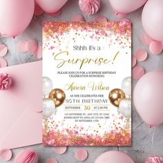 a pink and gold surprise birthday party with balloons