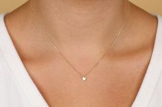 Dimensions of Star: 6 mm (less than a quarter of an inch) This dainty gold star can be worn on its own for a minimalist look or stacked up with other necklaces. The star is not flat, but thicker gold for a more solid look. Pair it with Sarah Elise mini moon necklace for a truly celestial look! Available 14K Solid White, Solid Yellow, Solid Rose Gold Worldwide DHL shipping now available 1-3 business days NOW USING ITALIAN TRIGGER LOBSTER CLASPS 🛠 All Sarah Elise pieces are handcrafted to order, Delicate Yellow Gold Star Jewelry, Dainty Star-shaped Yellow Gold Jewelry, Dainty Yellow Gold Star Jewelry, Tiny Star-shaped 14k Gold Jewelry, Gold Star Necklace, Star Necklace Gold, Star Charm Necklace, Mini Moon, Celestial Necklace