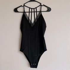 Size Small V Cut Excellent Condition! Bundle And Save! Black Lace Trim Bodysuit For Summer, Black Underwire Bodysuit With Lace Closure, Fitted Printed V-neck Bodysuit, Black V-neck Bodysuit With Built-in Bra, Strappy Bodysuit, V-neck Stretch Bodysuit With Smoothing Detail, Beachwear Floral Print V-neck Bodysuit, Strapless Bodysuit, Sheer Bodysuit