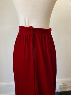 Vintage Dark Red Velvet Maxi Skirt 1970's 70's Red Velvet Gothic Full Length High Rise Skirt. In great condition! No tags on this item, but would best fit a 24 inch waist. Measurements are taken while garment is laid flat and are as follows: Waist: 12 inches Hip: 17 inches Length: 42 inches Red Lined Skirt For Evening Wear, Vintage Full-length Lined Skirt, Vintage Full Skirt For Party, Vintage Party Lined Skirt, Vintage Red Full Skirt Bottoms, Vintage Red Skirt For Party, Red High Waist Lined Maxi Skirt, Vintage Red Bottoms For Party, Vintage Red Party Skirt