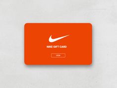 an orange nike gift card sitting on top of a table