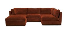 a brown sectional couch sitting on top of a white floor