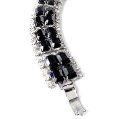 "Item: This is a classic 1950s rhinestone bracelet with rectangular jet black glass emerald cut stones and clear rhinestones on a silver tone setting. It's perfect for that \"little black dress\" or any outfit when you want a little black and silver bling. It's in excellent condition and ready to wear. Be sure to Favorite this piece and check our other listings for lots more antique and vintage jewelry! Signature: Unsigned Measurements: 1\" w x 7\" long Condition: 9.5 - Excellent condition Shipp Rectangular Crystal Jewelry For Evening, Evening Metal Crystal Bracelet, Glamorous Formal Jewelry With Black Diamonds, Glamorous Black Diamond Jewelry For Formal Events, Glamorous Black Diamond Jewelry For Formal Occasions, Glamorous Formal Black Diamond Jewelry, Formal Jeweled Crystal Bracelet, Evening Crystal Bracelets Costume Jewelry, Formal Crystal Costume Jewelry Bracelet