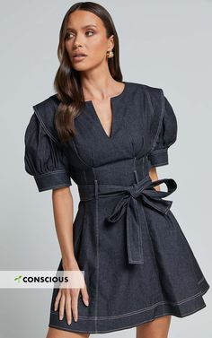 Stand out from the crowd in our Dolores Mini Dress! This casual black dress features a close V-neckline and short puff sleeves for an effortlessly chic look. Made from cotton, this shift dress is not only comfortable but also breathable, making it perfect for those warm summer days. The belted waist adds definition to your figure, giving you a flattering silhouette. Whether you're heading out for brunch with friends or attending a casual event, this mini dress is sure to turn heads and make you Casual Black Dress, Short Puff Sleeve, Black Dresses Casual, Casual Black, Belted Dress, Summer Days, Puff Sleeves, Dress Making, Shift Dress