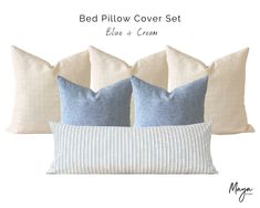 three pillows with blue and cream striped pillow covers on them, one is made out of linen