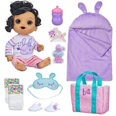 a baby doll with accessories including a blanket and diaper