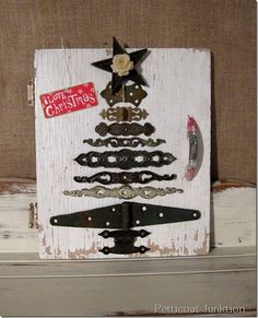 a christmas tree made out of old door knobs