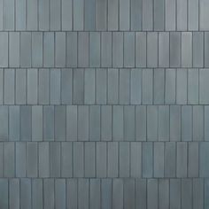 an image of a building that looks like it is made out of grey bricks or tiles