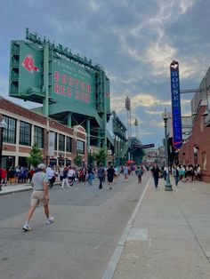 people walking on the street in front of boston red sox stadium