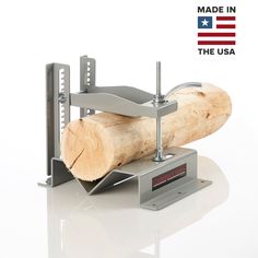 a piece of wood that has been cut in half and is being held by a machine