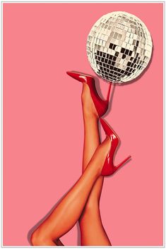 a woman's legs in red heels with a disco ball on top of her head