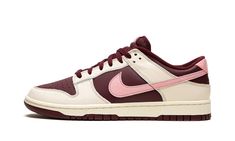 The Nike Dunk Low Premium “Valentine’s Day 2023” is a festive colorway of the retro basketball shoe that celebrates the Lover’s Holiday.  The “Valentine’s Day” Dunk Low is the 2023 version of the popular theme that shows love, no pun intended, to Valentine’s Day.  This time around, the shoe features a two-tone, maroon and Pale Ivory color combination.  Specifically, maroon leather appears on the base while Pale Ivory leather overlays.  A pink tumbled leather Swoosh is found on either side of the Valentines Day Dunks, Nike Dunk Low Colors, Valentine Dunks, Valentine Shoes, Nike Dunks Low, Maroon Shoes, Sneaker Displays, Kobe Shoes, Retro Basketball Shoes