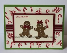 a christmas card with two gingerbreads on it