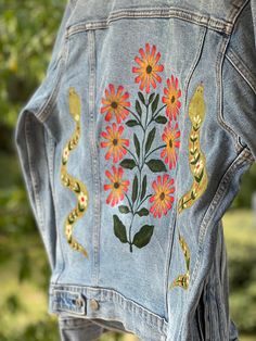 Size MEDIUM unisex THRIFTED denim jacket with hand painted folk art on the back. Sending to a friend? Add a gift message in the space provided. As always, thank you a thousand times for choosing Amanda Rose Makes for your special handmade art. Your support helps me live my dream.  If you have any questions, comments or concerns, email me anytime at @amandaroseyo@gmail.com You can follow me on Instagram for a detailed collection of the work I've done or for inspiration on your piece! @amandarosem Hand Painted Jacket Ideas, Artistic Denim Jacket With Custom Artwork For Spring, Spring Artistic Denim Jacket With Custom Artwork, Blue Denim Jacket With Custom Artwork For Spring, Hand Painted Long Sleeve Denim Jacket For Spring, Spring Denim Jacket With Custom Artwork, Spring Casual Denim Jacket With Custom Artwork, Casual Spring Denim Jacket With Custom Artwork, Artsy Cotton Denim Jacket For Spring