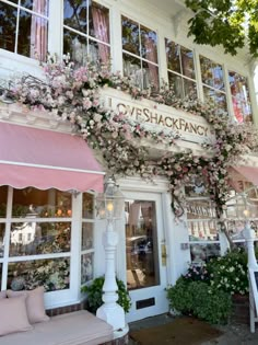 a store front with lots of flowers on it