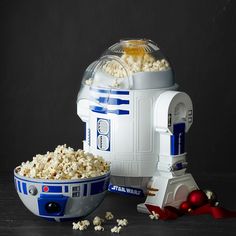 a bowl of popcorn and a star wars machine