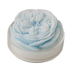 a white container filled with blue and white frosting on top of a white surface