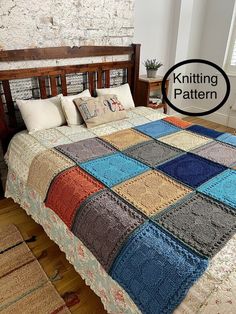 a bed with a multicolored blanket on top of it