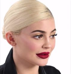 a woman with blonde hair and red lipstick