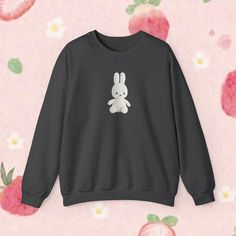 A Miffy plush you can wear! How cute!!  Ideal for any occasion, this unisex heavy blend crewneck sweatshirt is pure comfort. These garments are made from polyester and cotton. This combination helps designs come out looking fresh and clean. The collar is ribbed knit, so it retains its shape even after washing. There are no itchy side seams on these sweaters.  Materials/More Info: - 50% cotton, 50% polyester -  Medium-heavy fabric (8.0 oz/yd² (271.25 g/m - Loose fit - Sewn-in label - Runs true to Cute Crew Neck Hoodie For Streetwear, Cute Fleece Hoodie With Crew Neck, Cute Fleece Hoodie Sweatshirt, Cute Fleece Crew Neck Hoodie, Cute Fleece Crew Neck Sweater, Cute Gray Sweatshirt For Winter, Cute Black Crew Neck Sweater, Cute Cartoon Print Hoodie With Crew Neck, Cute Fleece Sweatshirt With Letter Print