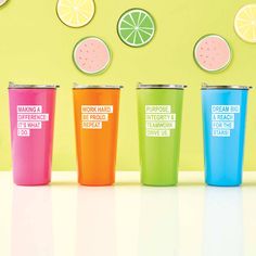 three different colored tumblers sitting next to each other