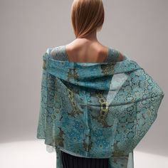 "Fractal beauty on silk chiffon in subtle shades of light blue and gold! This lovely, long shawl/scarf recalls the complexity of Islamic art, but the pattern is actually a multi-layered fractal design. Length is 78 inches, long enough to knot and wrap almost any way you wish. The silk chiffon used for this scarf  is a very tight weave: amazingly smooth and luxurious to the touch, feels lovely to wear. * Digitally printed original design * 100% silk chiffon. * Approx. 78\" x 24\". * Machine hemmed * Dry clean only * Ironing is fine, press cloth recommended to prevent staining * Arrives packed in an elegant gift-box" Silk Shawl With Sheer Dupatta, Silk Sheer Dupatta Shawl, Elegant Blue Silk Dupatta, Blue Silk Scarf For Wedding, Silk Shawl Scarf, Blue Silk Shawl Dupatta, Elegant Blue Shawl Scarves, Elegant Blue Silk Shawl Scarf, Elegant Blue Silk Shawl