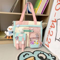 ICS329 Cool Backpack - Style Meets Functionality! Step up your style game with the ICS329 Cool Backpack – the perfect mix of fashion and functionality designed especially for our Kawaii Teens and trendsetting girls! This adorable backpack is made from tough nylon and boasts a Softback design, charming applique decoration, and a one-of-a-kind Patchwork Pattern, bringing a touch of Preppy Style to your wardrobe. Experience ultimate comfort with the Soft Handle and Arcuate Shoulder Strap Carrying S Harajuku Style Backpack For Study, Harajuku Style Bag For Back To School, Harajuku Style Back To School Bag, Harajuku School Bags With Pockets, Harajuku Style Pink Bags For Back To School, Harajuku Style Standard Backpack For Study, Pink Harajuku Style Back-to-school Bags, Kawaii School Bag With Pockets, Harajuku Style Standard Backpack With Zipper