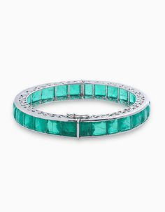 This bracelet is made using Emerald which are elegantly set in a line, which gives it a very elegant look. Each bracelet is substantial on its own and great for piling up. This bracelet's spectacular stones catch the light with every gesture. About the Product: Metal: Solid 925 Sterling Silver Stones: Cubic Zirconia Grade: AAAAA Cut: Excellent Clarity: Excellent Why Buy from Adastra? 1. The USA patented 925 Sterling Silver, making each creation last for decades. 2. Each of our products is skin-f Handmade Anniversary Gift, Handmade Anniversary Gifts, Cocktail Bracelet, Statement Bracelets, Heritage Jewellery, Historical Jewellery, Edwardian Style, Edwardian Fashion, Royal Jewelry