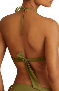 Look your best as you lay poolside in this bikini top featuring cutouts on the halter ties. Ties at neck and back 73% polyamide, 27% elastane Hand wash, line dry Imported T-back Tie Back Halter Top For Vacation, Nylon Halter Top With Built-in Bra, Chic Triangle Halter Top For Sunbathing, Beachwear Bandeau Halter Top For Swimming, Chic Tie Back Halter Top For Swimming, Stretch Backless Halter Top For Beach Party, Poolside Nylon Tankini With Triangle Top, Nylon Halter Neck Swimwear For Vacation, Green Triangle Halter Top With Built-in Bra