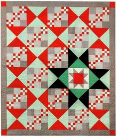 a red and grey quilt with black, white, and green squares