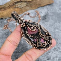 Description: "Discover the elegance of natural Rhodonite with this handmade copper wire-wrapped pendant. Each piece is crafted with care to showcase the unique beauty of the gemstone. Perfect for adding a touch of natural charm to any outfit or as a thoughtful gift for someone special." Shipping And Handling - Domestic & International - Free Shipping Charges Handling Time- 1 to 3 Day Delivery Time- 05 To 23 Working Days Shipping Services-India Post, USPS, DHL ecommerce Express Shipping -DHL Express & FedEx Order Above $100 will eligible for Express Shipping Returns & Cancelation 1. We offer a 100% Money Back Guarantee minus shipping for 30 days after receiving the item/items. 2. The item must not be altered or damaged in any way shape or form. 3. Upon receiving the items your payment will Raw Opal, Wrapped Pendant, Handmade Copper, Wire Wrapped Pendant, Handmade Pendants, Copper Wire, Chains Jewelry, Pendant Jewelry, Thoughtful Gifts