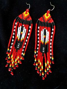 Handmade Native American style fire feather earrings. Bold and beautiful these are very lightweight. I do custom orders as well, and can change the background color (red in these ones) to whatever you like. If you do order a custom pair please allow an extra day for me to make them. Southwestern Style Red Beaded Earrings As Gift, Southwestern Red Beaded Earrings As Gift, Southwestern Style Red Earrings For Festival, Red Teardrop Beaded Earrings For Festival, Southwestern Style Red Beaded Earrings For Gift, Red Southwestern Style Earrings For Festivals, Southwestern Red Earrings For Festival, Feather Beaded Earrings Patterns, Red Southwestern Style Earrings With Round Beads