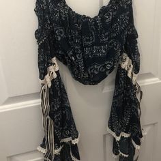 Cropped Top, Navy Blue Color With Paisley Pattern. Flowy, Layered Sleeves With Lace Detail. Ribbon On Sides Of Sleeves Can Be Tied. Cute And Cool For Summer, Or Would Look Great In The Fall With High Waisted Jeans Or Skirt. Never Worn. Nwot. Size Med. Hippie Cotton Peasant Top For Beach, Blue Boho Print Tops For Festival, Blue Cotton Peasant Top For Beach, Blue Cotton Bohemian Tops, Blue Bohemian Cotton Tops, Bohemian Ruffled Peasant Top For Beach, Bohemian Blue Cotton Tops, Fitted Bohemian Peasant Top For Beach, Blue Boho Print Top For Festival