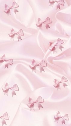 pink satin fabric with bows and ribbons on the top, as if it were an origami