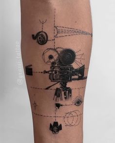 a man's leg with an image of a camera and other things on it