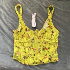 Nwt Urban Outfitters Uo Carlyn Tank Top Size S A Cropped Tank Top From Uo. Cut With A Scoopneck. Cropped Just Above The Waist. Finished With Wide Straps And A Curved Hem. Color: Gold (Via Uo Website) 96% Polyester, 4% Spandex No Flaws/Damages To Lists. See Pics For Approx Measurements/Details/Condition. Send Me A Reasonable Offer :) Urban Outfitters Yellow Tops For Spring, Yellow Urban Outfitters Top For Spring, Trendy Yellow Tops From Urban Outfitters, Fitted Yellow Top From Urban Outfitters, Yellow Lemon Print Beach Top, Yellow Urban Outfitters Top For Vacation, Yellow Halter Top, Fringe Tank Top, Urban Outfitters Top