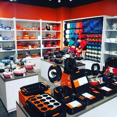 an orange and black store with lots of items on display