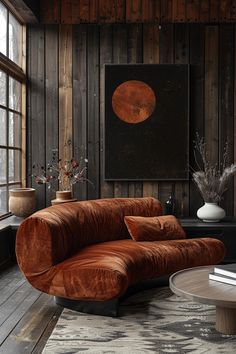 a living room filled with furniture and wooden walls