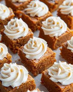 several pieces of cake with white frosting on top