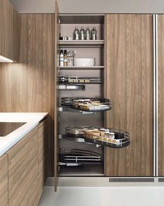 a kitchen with wooden cabinets and shelves filled with food