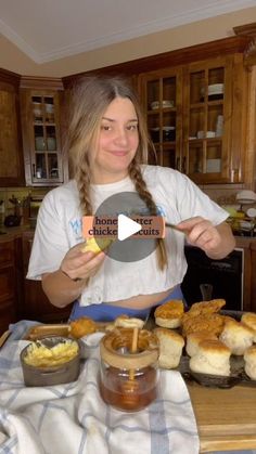 a woman sitting at a table with some food in front of her and the words my honey chicken cuts on it