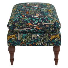 the footstool is covered in an animal print